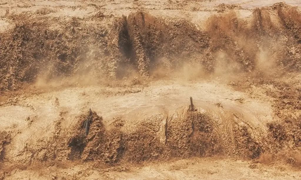 The thundering Hukou Waterfall—the Yellow River’s only waterfall—plunges down a narrow gorge in spectacular fashion.